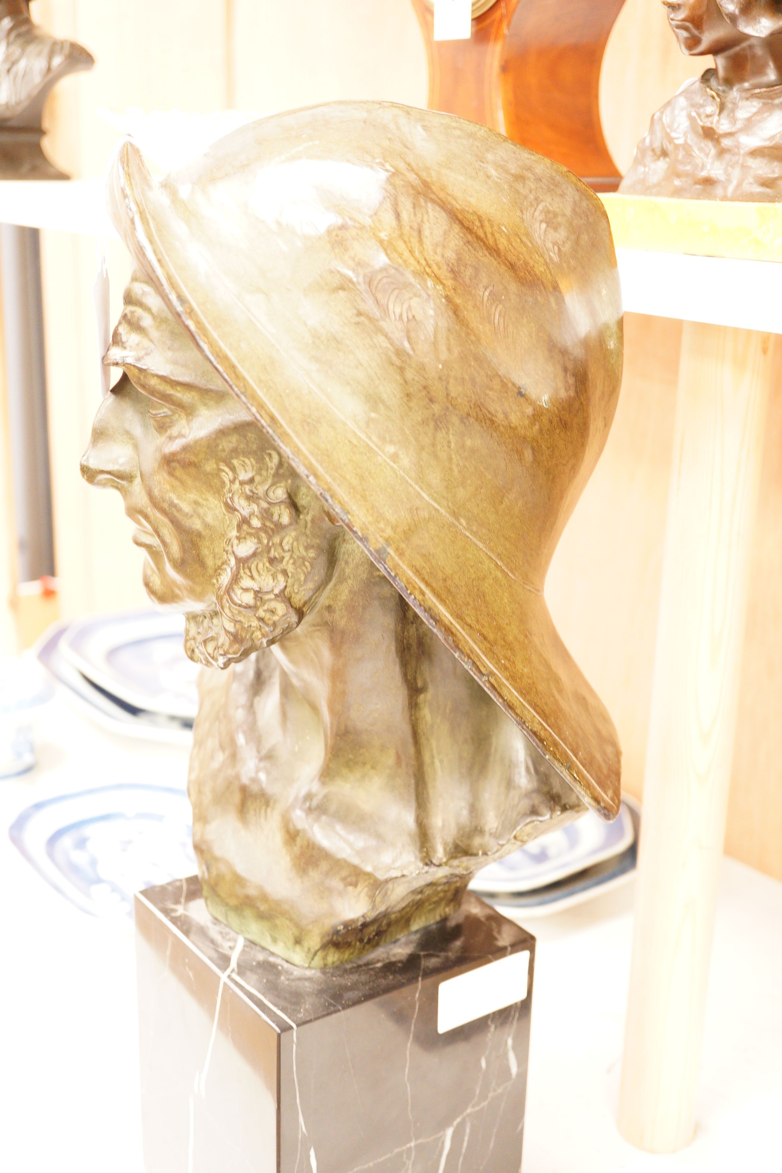 Johannes Dommisse (1878-1955) A cold painted terracotta bust of a fisherman on plinth base, 53cm tall